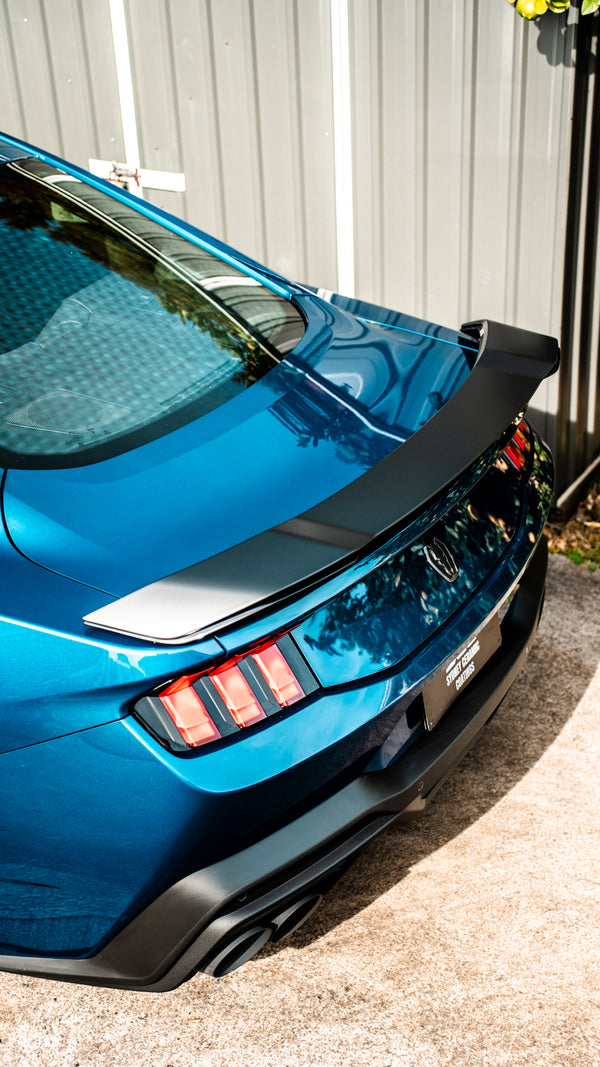 Rear view of a blue Ford Mustang 